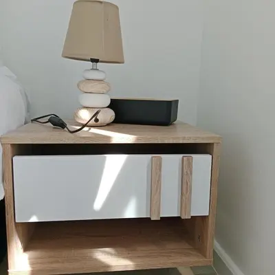 a table with a lamp on top of it at The Cozy Nest in Cape Town