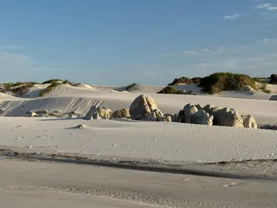 a desert with some rocks in the sand at Otter Cottage in Pringle Bay in Pringle Bay