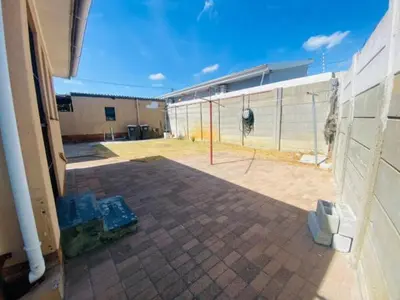 a view of a patio in a building with a fence at Eliot TM in Cape Town