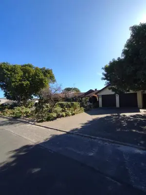 a house on a street with a driveway at Johannies Home at Panorama Hospital in Cape Town