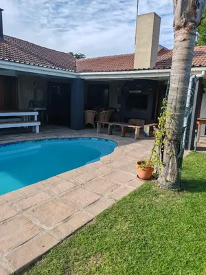 a swimming pool in the yard of a house at Johannies Home at Panorama Hospital in Cape Town