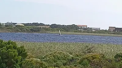 a boat in the middle of a river at Two Lakes in Bettyʼs Bay