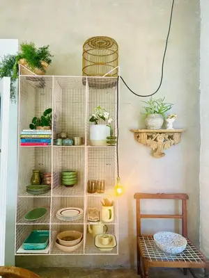 a shelf with dishes and plants in a room at Stellenbosch Farm Studio Apartment in Penhill