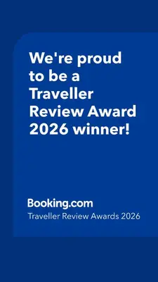 a blue sign that says were proud to be a traveller reviewagency winner at Waters Edge Luxury Apartment Century City in Cape Town