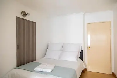 a bedroom with a bed with two towels on it at Vredekloof Views in Cape Town