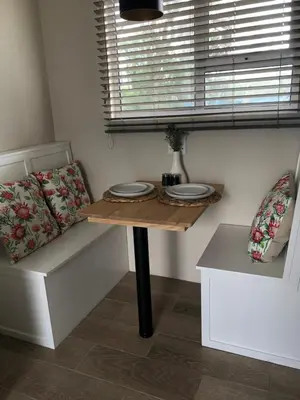 a table with two plates on it in a room at Bettys Bay Breakaway in Bettyʼs Bay