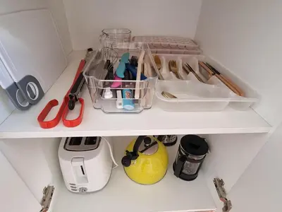 a white refrigerator filled with lots of kitchen utensils at Featherbed in Hermanus