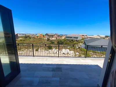 a view from the door of a balcony at 155 Hangklip self catering in Pringle Bay