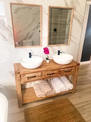 a bathroom with two sinks and a mirror at 155 Hangklip self catering in Pringle Bay