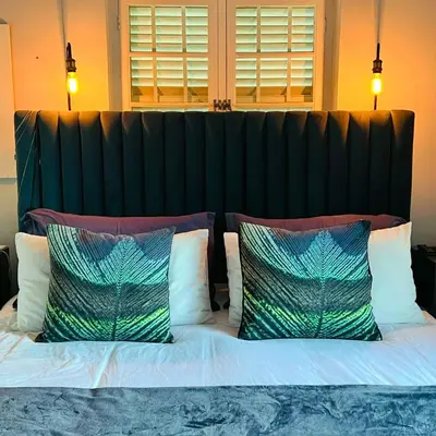 a large bed with two pillows on top of it at Spacious Stays Residence in Paarl