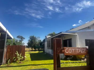 a sign that says coffee in front of a house at Hephzibah Inn Farm Cottage in Hermon
