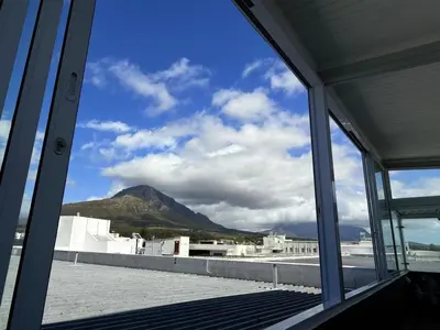 a view of a mountain from a window at Dior Maison de Reve- Private Penthouse in Stellenbosch