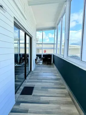 an empty hallway with windows and a desk in a building at Dior Maison de Reve- Private Penthouse in Stellenbosch