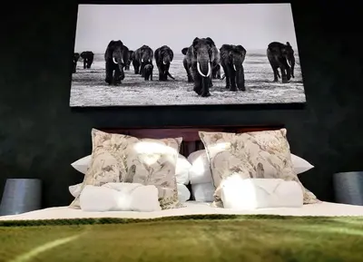 a black and white photo of a herd of elephants at Tide's whisper in Hermanus