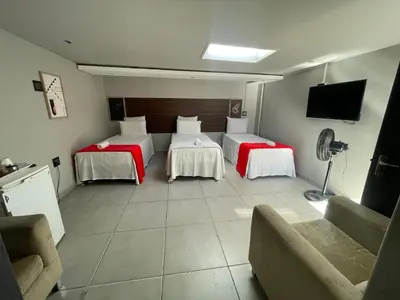 a hotel room with two beds and a couch at Ayan Contractors & Student Accommodation in Avondale
