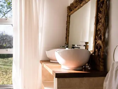 a bathroom with a sink and a mirror at Morgenzon Farm in Wellington