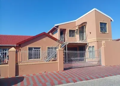 a house with a fence in front of it at Malithabo in Khayelitsha