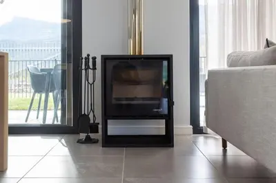a flat screen tv sitting on a stand in a living room at Luxury Golf Villa 710, Pearl Valley Golf Estate in Simondium