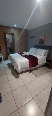 a bedroom with a large bed in a room at The Resting Nest in Mandalay