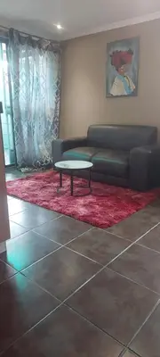 a living room with a couch and a coffee table at The Resting Nest in Mandalay
