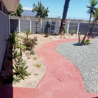 a red brick walkway in front of a house at Fairbridge Queens and Kings Guest House in Cape Town