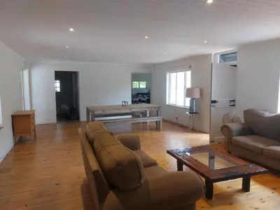 a living room with a couch and a table at Greystone in Greyton