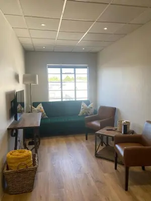 a living room with a green couch and chairs at Pistachio - Paarl - Self Catering Apartment in Paarl