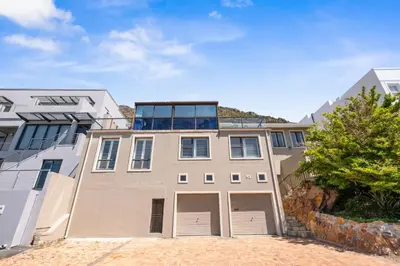 an apartment building with a balcony on top of it at Suikerbossie 83 in Cape Town