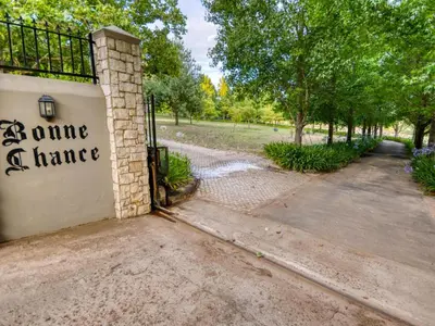 a gate to a house with a sign that says anytime dance at Bonne Chance Luxury Estate in Lynedoch