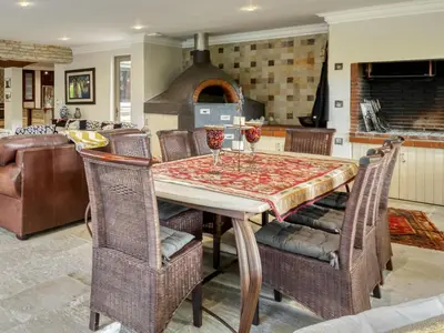 a kitchen with a table with wine glasses on it at Bonne Chance Luxury Estate in Lynedoch