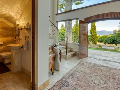 a bathroom with a sink and a large window at Bonne Chance Luxury Estate in Lynedoch
