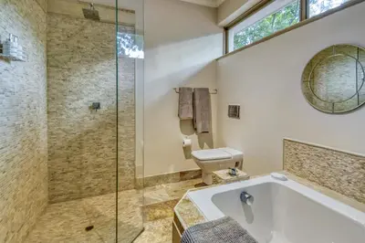 a bathroom with a tub and a toilet at Bonne Chance Luxury Estate in Lynedoch