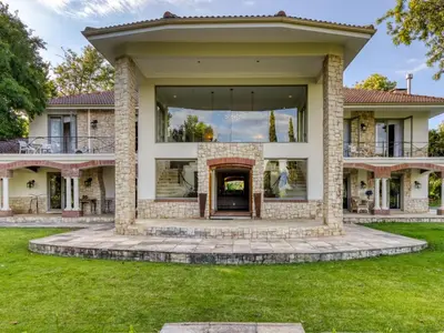 a house with a large window on the front of it at Bonne Chance Luxury Estate in Lynedoch