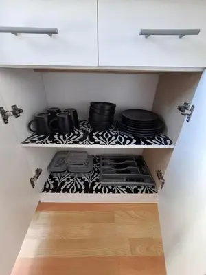 a kitchen with a black and white stove with pots and pans at Grey Vine Cottage - Guest Room in Cape Town