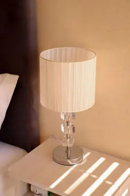 a table with a lamp on top of a bed at Tygerviews on Uys in Tygerberg Hills