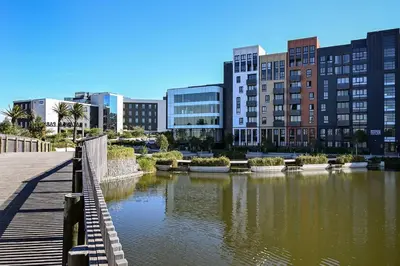a bridge over a body of water in a city at Luxury Three Bedroom Axis- Ocean and Mountain Views in Cape Town