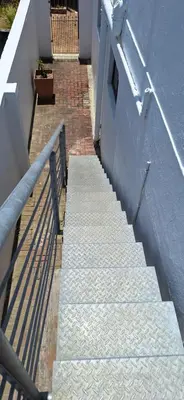 a set of stairs leading up to a building at 33 on Vermont in Hermanus