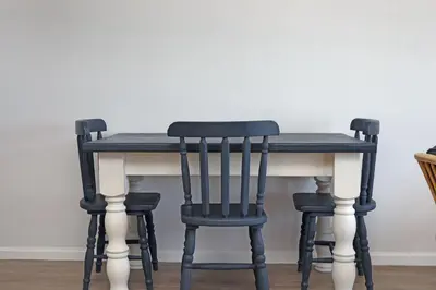 a black and white table with two chairs around it at Witsand 303 in Cape Town