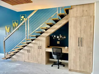 an office with a desk and a staircase at Ultra Luxury 3 Bed Knightsbridge Penthouse in Cape Town