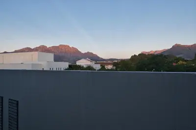 a view of a building with mountains in the background at 126 Andringa Walk in Stellenbosch
