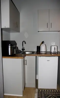 a kitchen with a sink and a counter top at Firehouse selfcatering Garden Cottage no 1 in Wellington