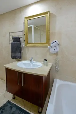 a bathroom with a sink and a mirror at Oude Hoek, Stellenbosch Central in Stellenbosch