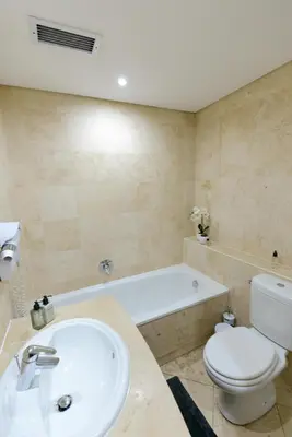 a bathroom with a sink and a toilet and a tub at Oude Hoek, Stellenbosch Central in Stellenbosch