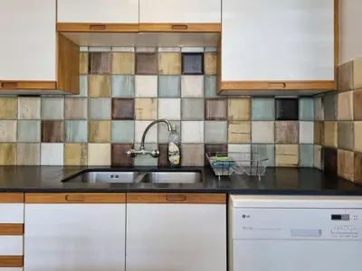 a kitchen with a sink and tiles on the wall at 'Country Beach House' - Traditional Family Vacation Home for 6 - Near Beach in Gordonʼs Bay