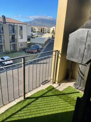 a balcony with a view of a street at Beautiful 2 bedroom apartment in strand in Somerset West