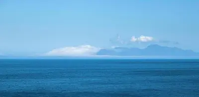 a view of the ocean with a mountain in the background at Tweede Boom in Cape Town