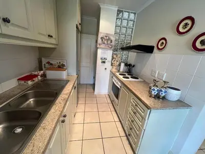 a kitchen with a sink and a counter top at 16 on Fernkloof in Hermanus