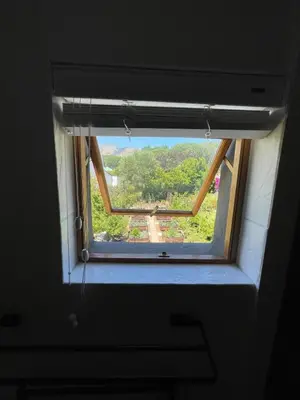 a window in a room with a view at The Studio - a lovely 1 bed loft apartment in Somerset West