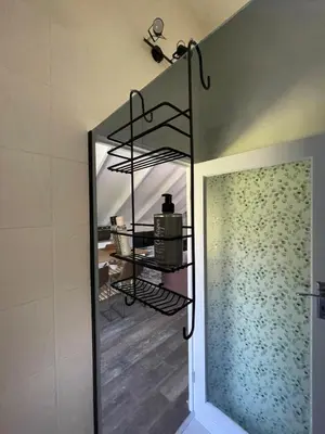 a shower in a bathroom with a glass door at The Studio - a lovely 1 bed loft apartment in Somerset West