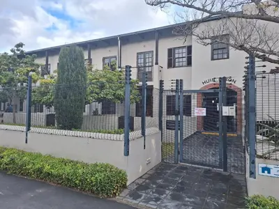 a gate in front of a white building at Studio in Central Stellenbosch in Stellenbosch
